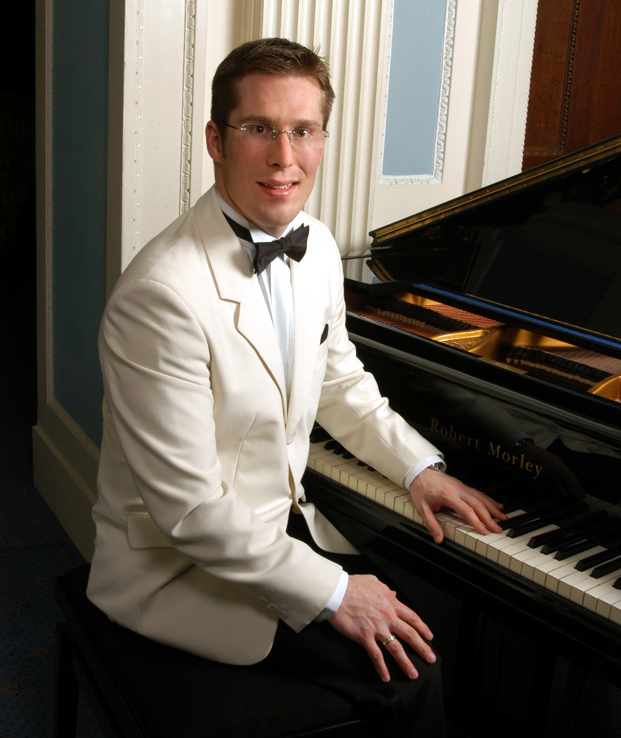 young boy sitting in barbers chair